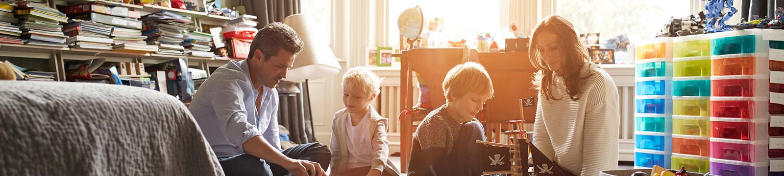 Family playing in their kids' room